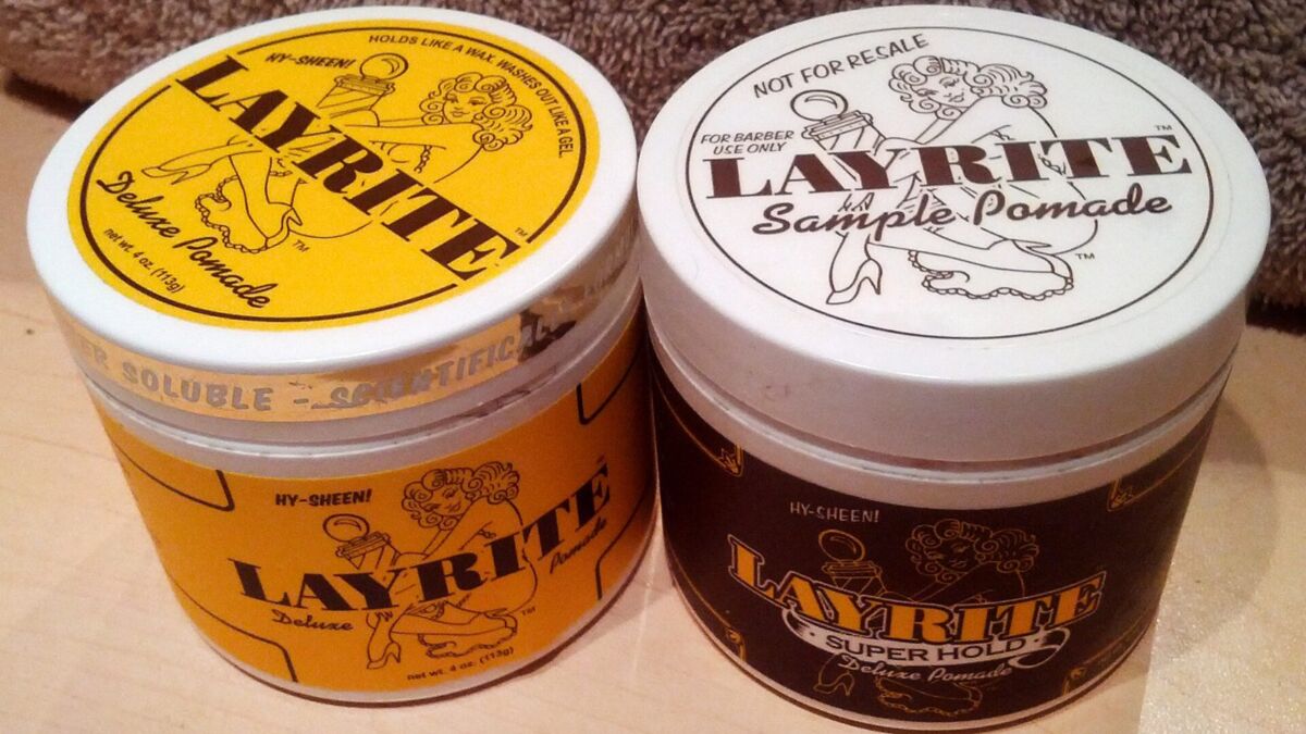 Due barattoli di cera per capelli